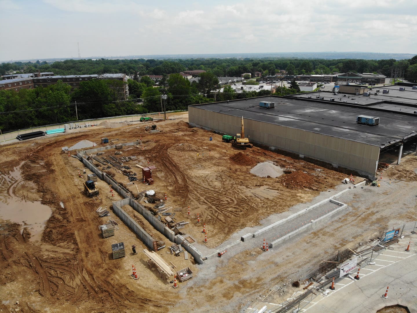 Aerial view of Aldi Store dirt lot and excavator