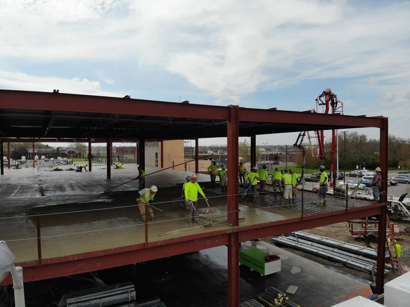 Workers pouring concrete floors