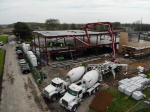 concrete flooring pour with 2 concrete trucks