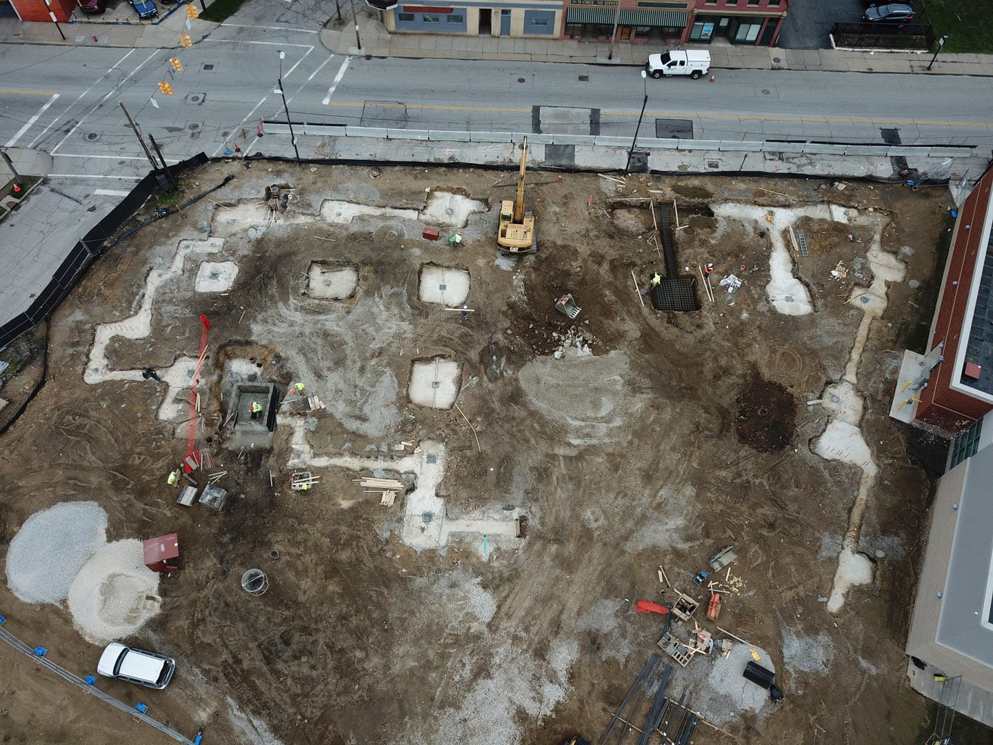 Aerial view of excavator and dirt plot