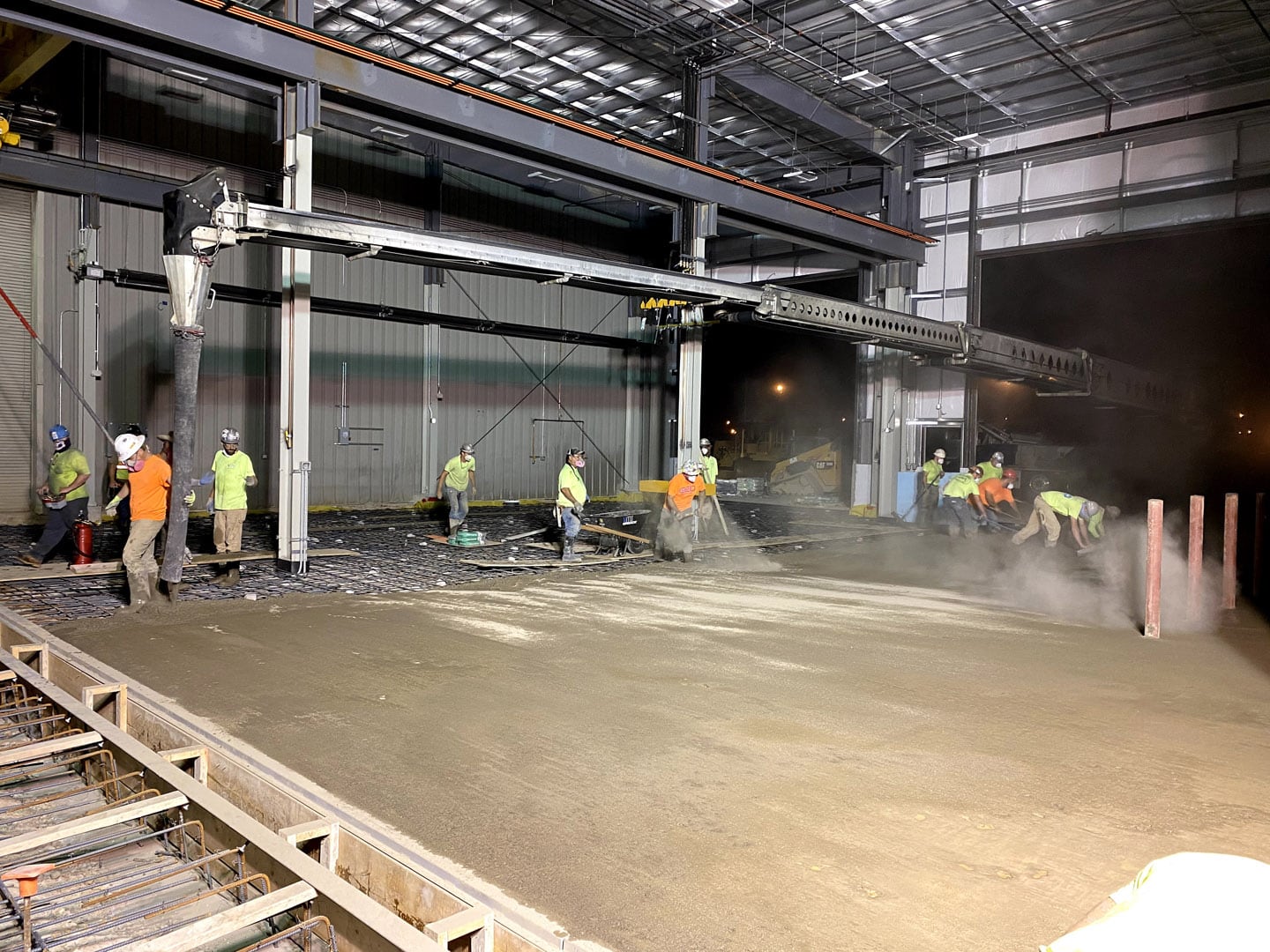 Interior flooring concrete pour with a full construction crew