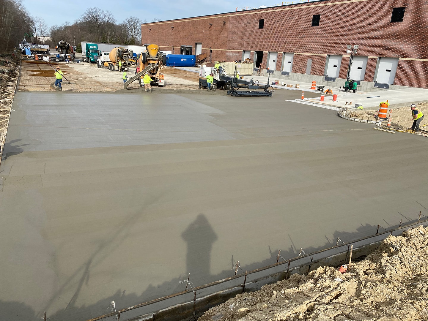 exterior wet concrete with workers